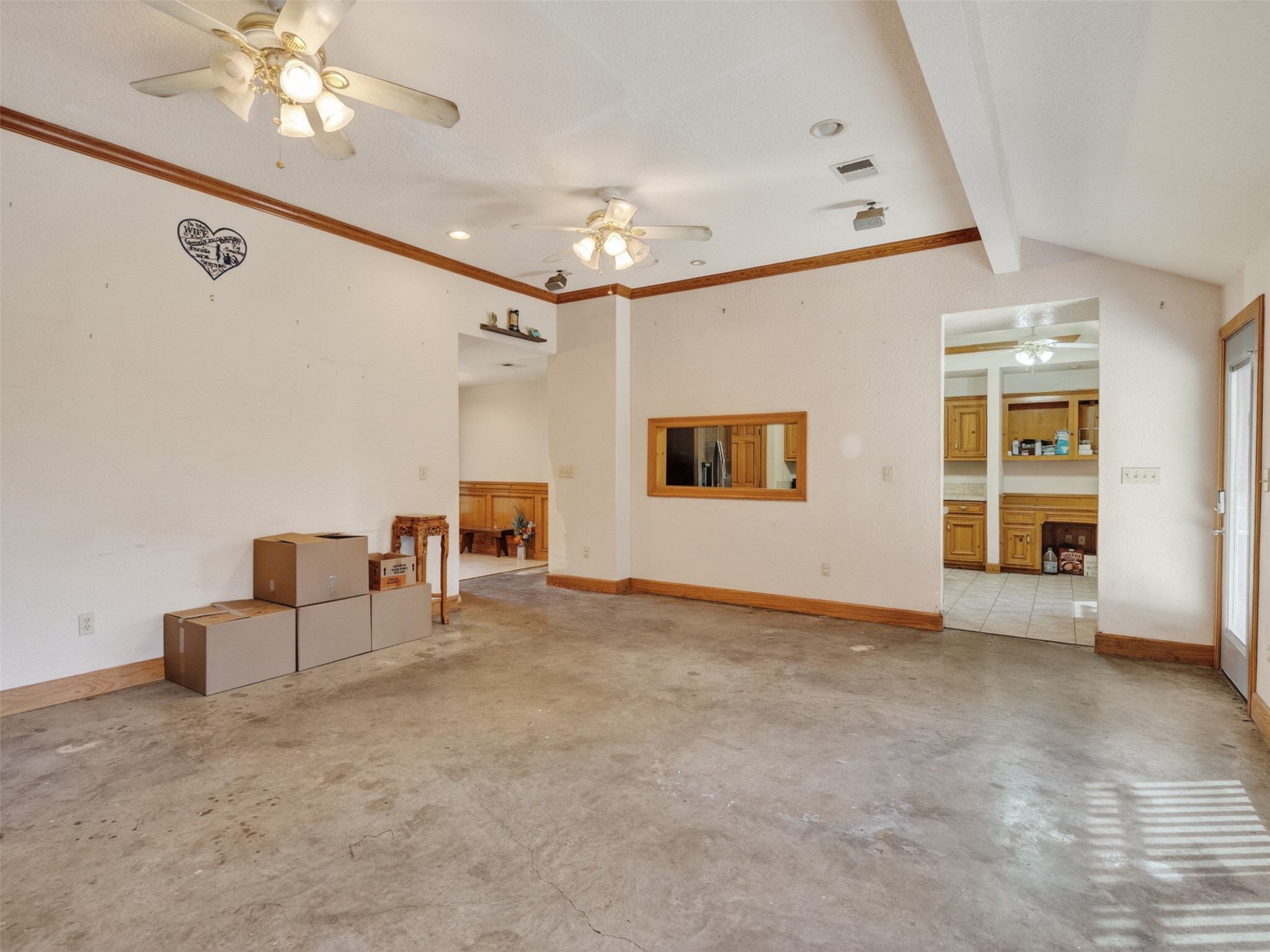 5036 Singletary Road Alvin, TX 77511 - Photo 6 of 35 Bright living room with easy access to the kitchen, creating a functional and connected living space.