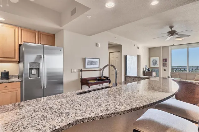 a kitchen with white cabinets and appliances