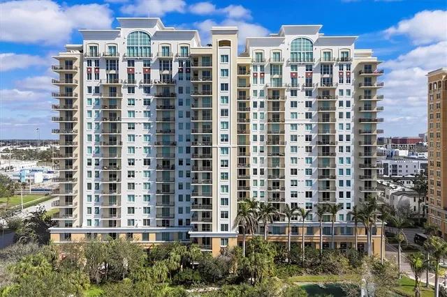 front view of a brick house with a yard