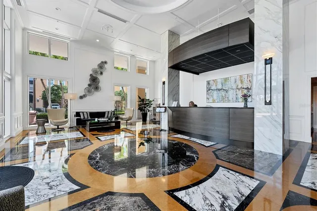 a view of a living room and kitchen view
