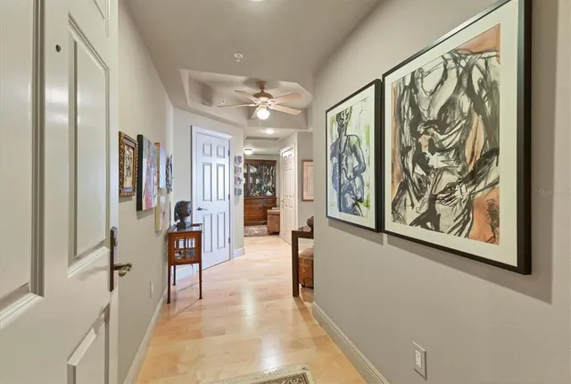 a living room with furniture and a lamp