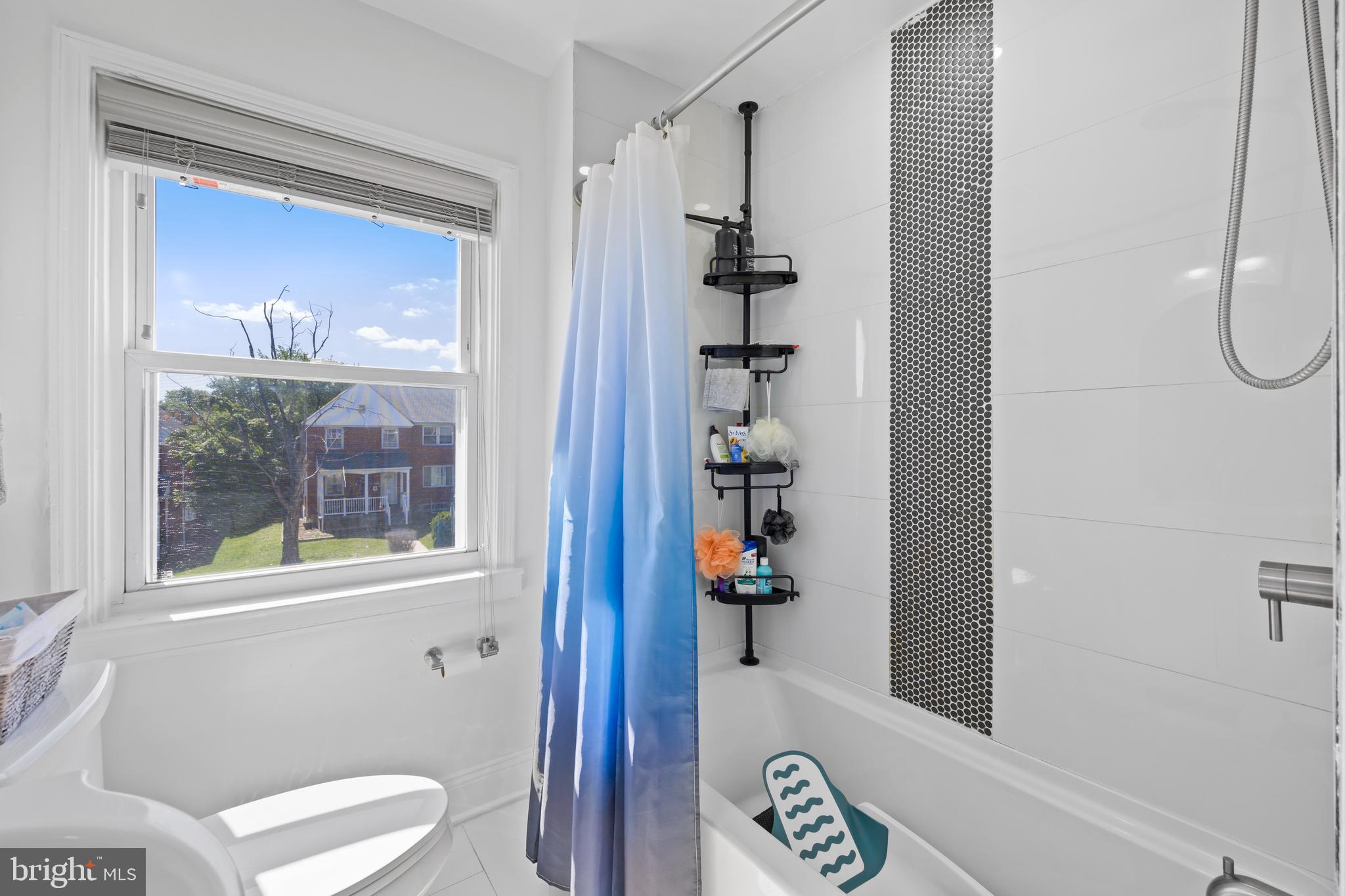 4511 Marble Hall Road Baltimore, MD 21239 - Photo 23 of 48 a bathroom with a toilet and a shower