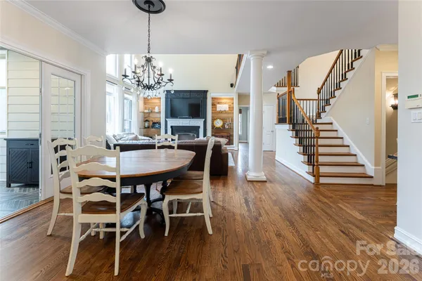 a view of a dining room with furniture and wooden floor