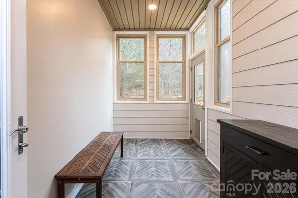 a room with a bed and a window