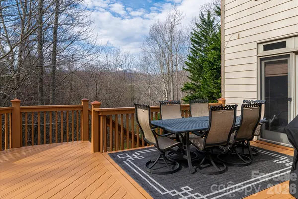 a view of a table and chairs on the roof deck