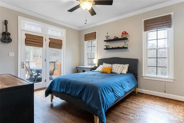 a bedroom with a large bed and a window