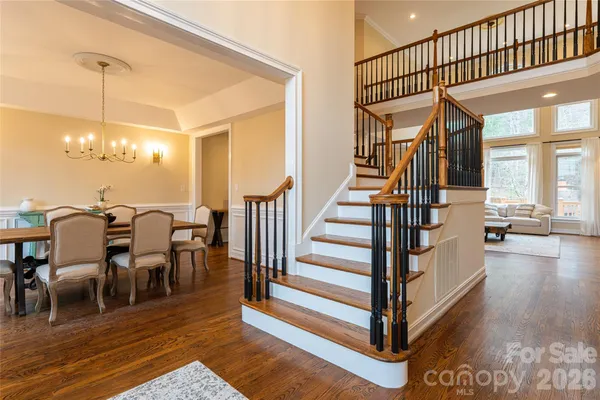 a view of a livingroom with furniture and staircase
