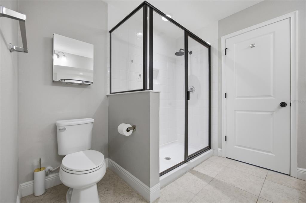 2013 Sunset Wind Loop Oldsmar, FL 34677 - Photo 21 of 43 a bathroom with a toilet sink and shower