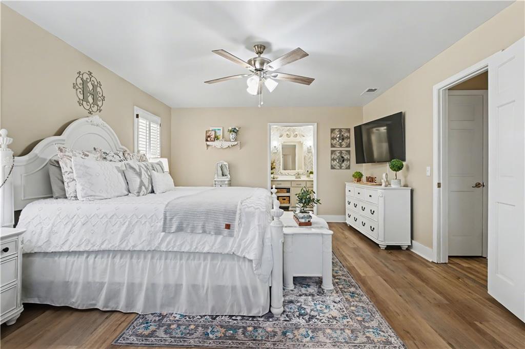 1833 Tom Odum Road Vidalia, GA 30474 - Photo 20 of 59 a spacious bedroom with a bed and a flat screen tv
