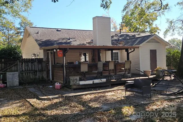 a front view of house with yard outdoor seating and barbeque oven