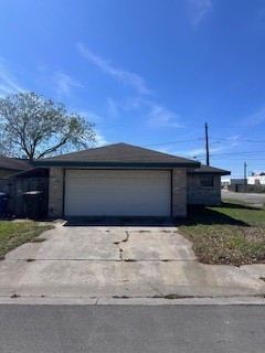 2425 Bevecrest Drive Corpus Christi, TX 78415 - Photo 3 of 11 a front view of a house with a yard