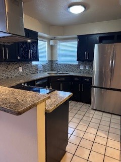 2425 Bevecrest Drive Corpus Christi, TX 78415 - Photo 4 of 11 a kitchen with granite countertop a sink and a refrigerator