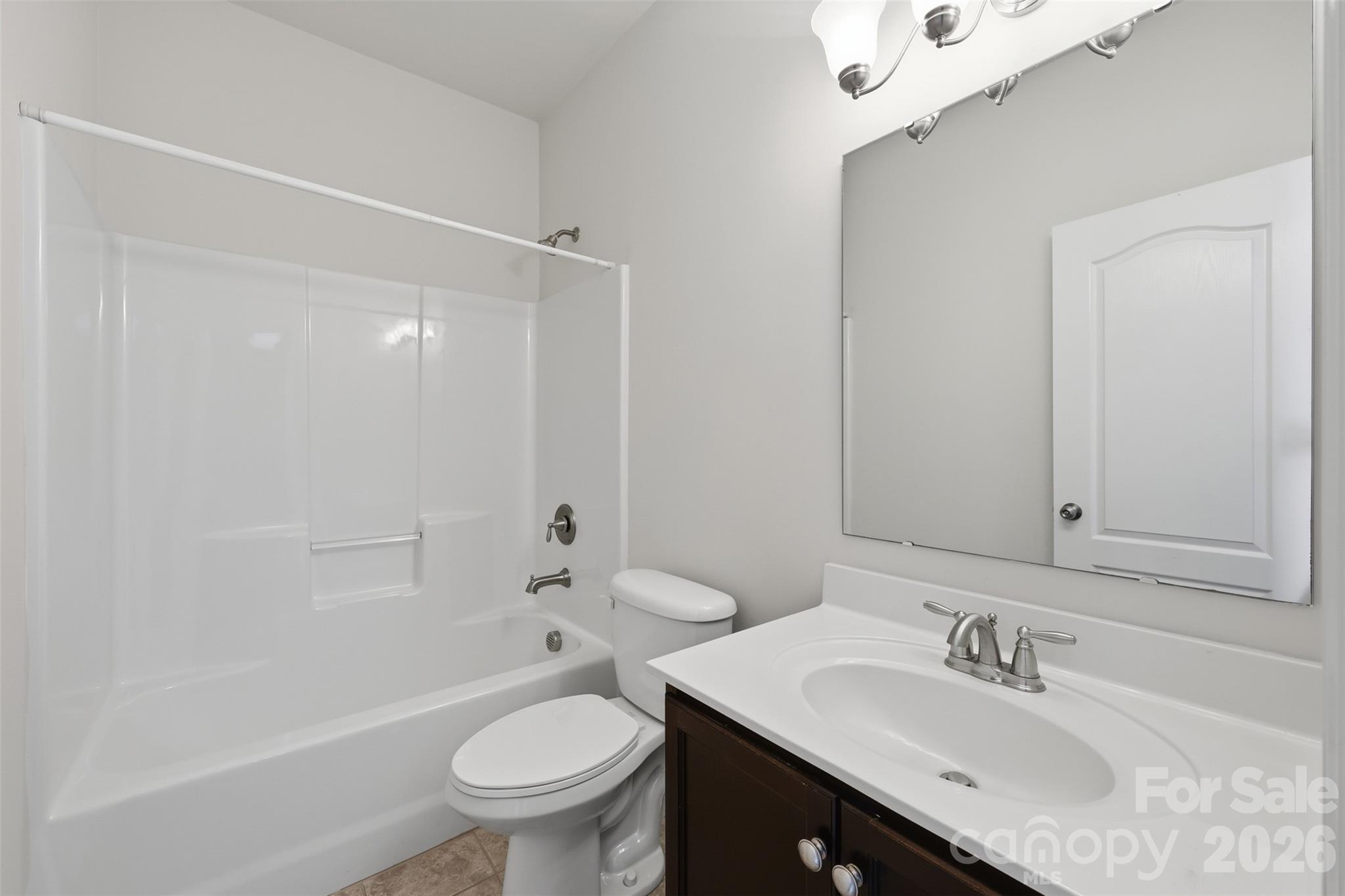 1722 Still River Way Fort Mill, SC 29708 - Photo 21 of 45 a bathroom with a sink toilet vanity and shower