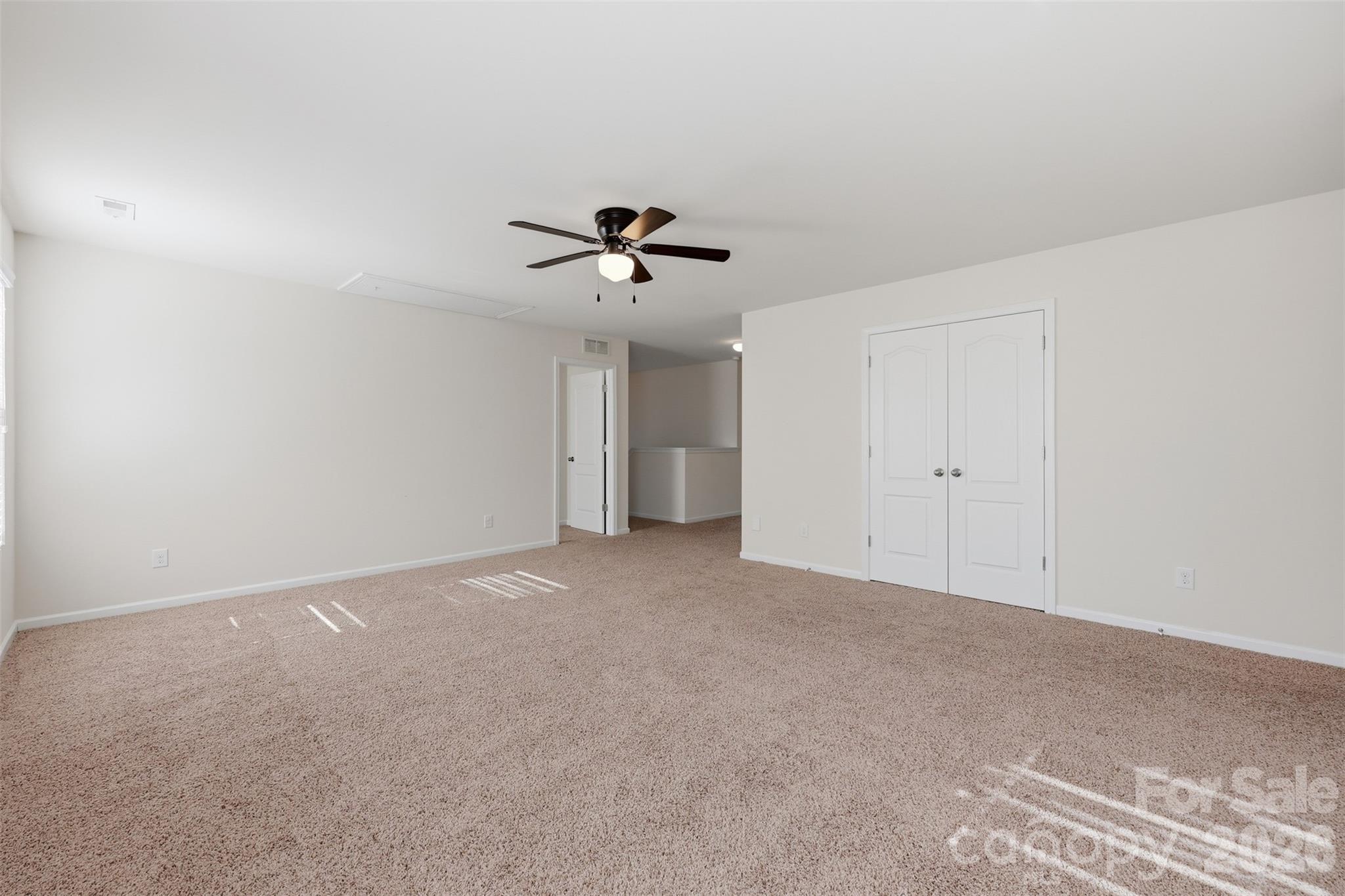 1722 Still River Way Fort Mill, SC 29708 - Photo 23 of 45 a view of an empty room with a ceiling fan