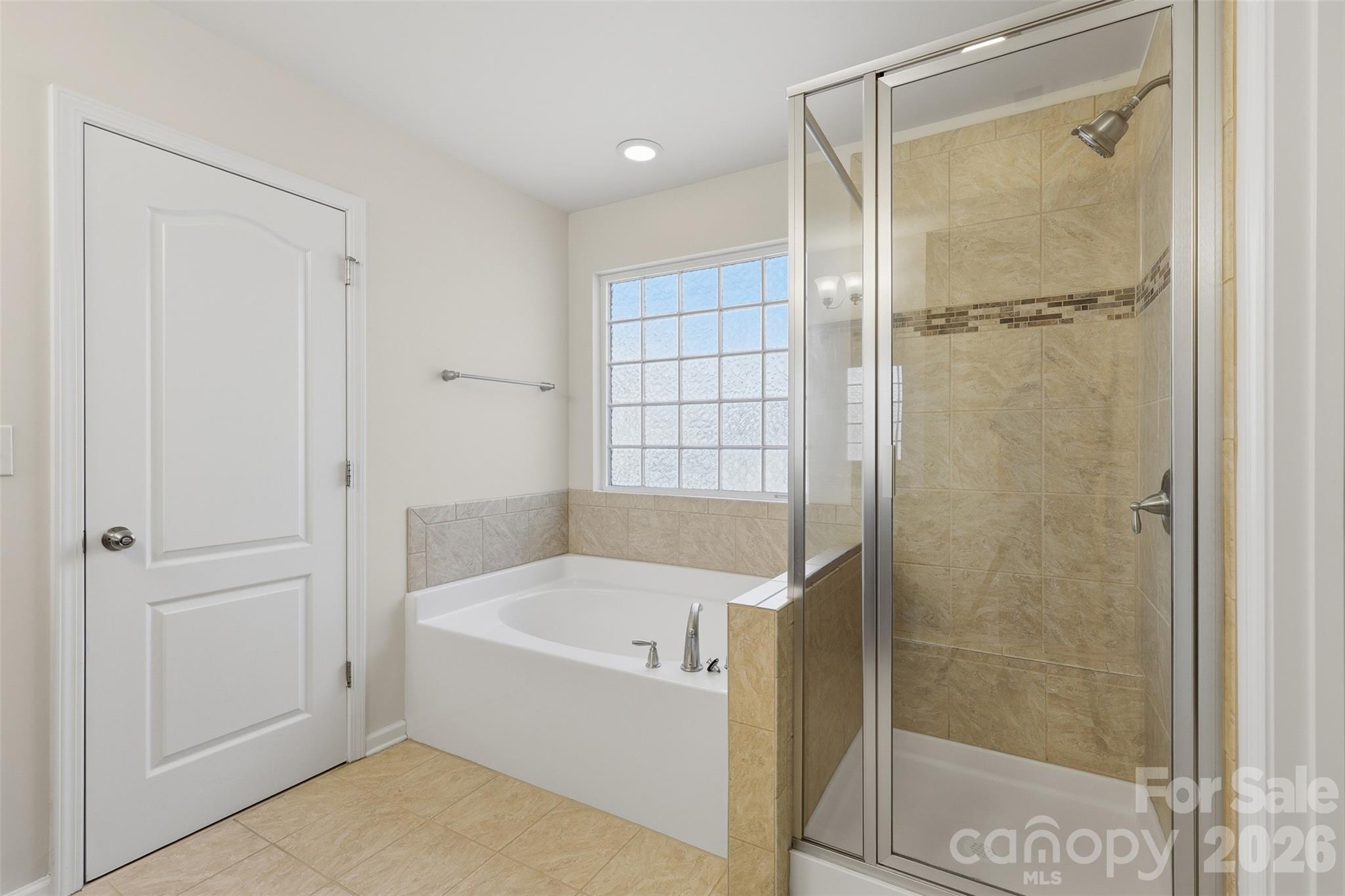 1722 Still River Way Fort Mill, SC 29708 - Photo 26 of 45 a bathroom with a bathtub and a shower