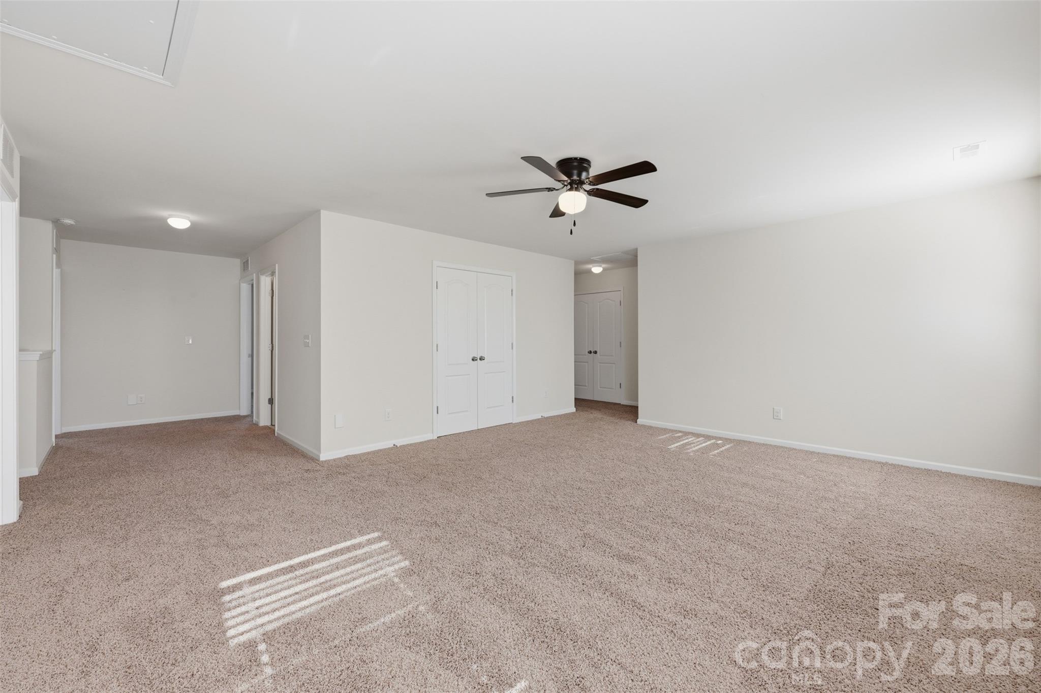 1722 Still River Way Fort Mill, SC 29708 - Photo 29 of 45 a view of an empty room with a ceiling fan