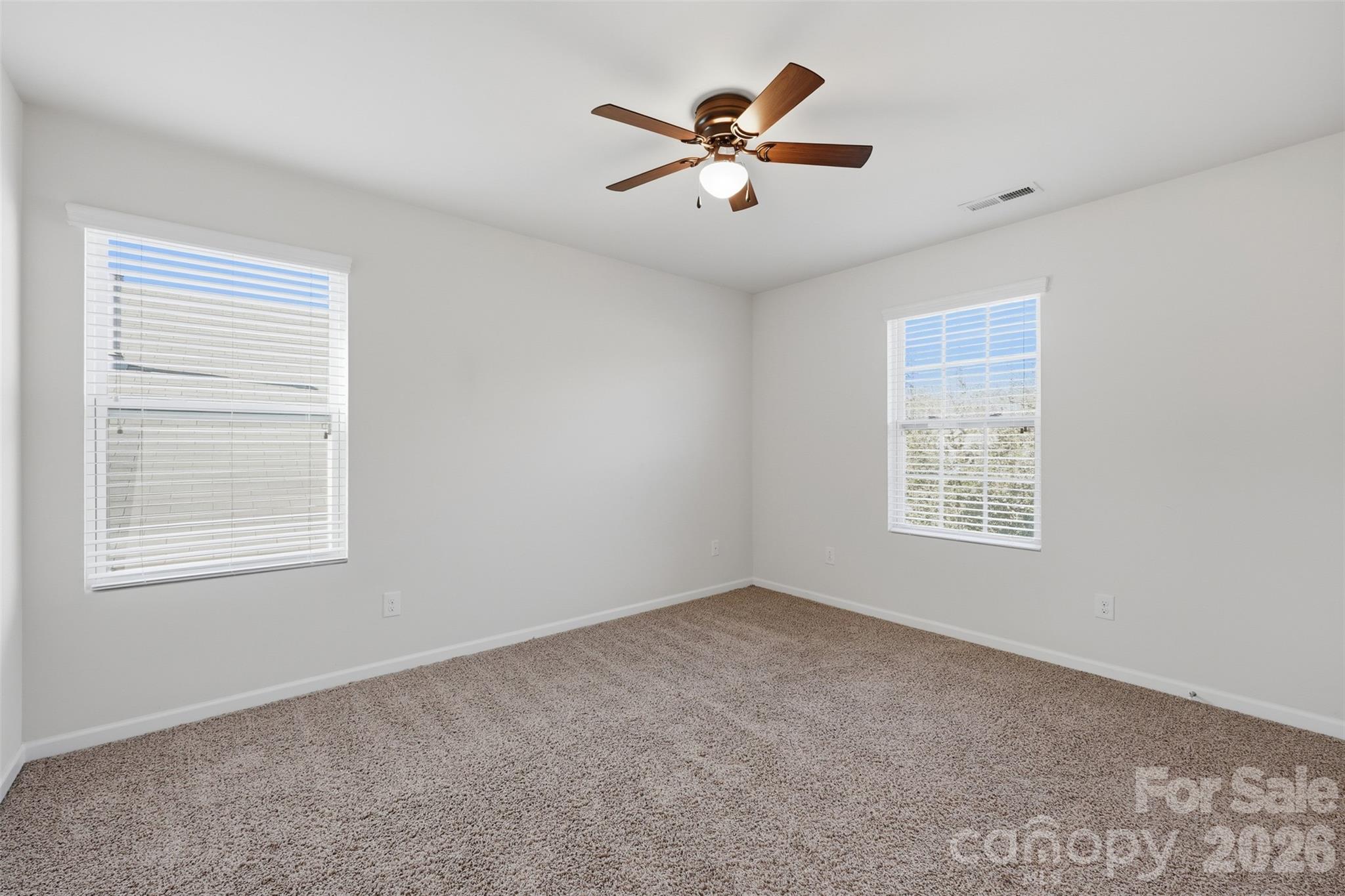1722 Still River Way Fort Mill, SC 29708 - Photo 33 of 45 a view of a livingroom with a ceiling fan and window