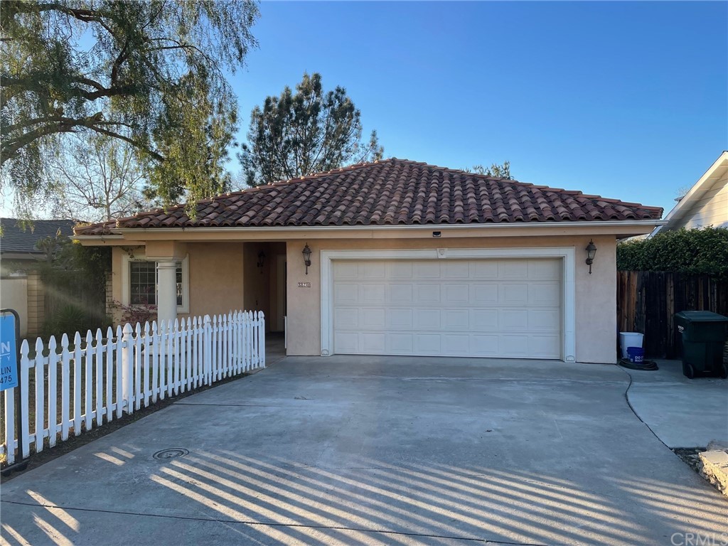 a front view of a house with a garage