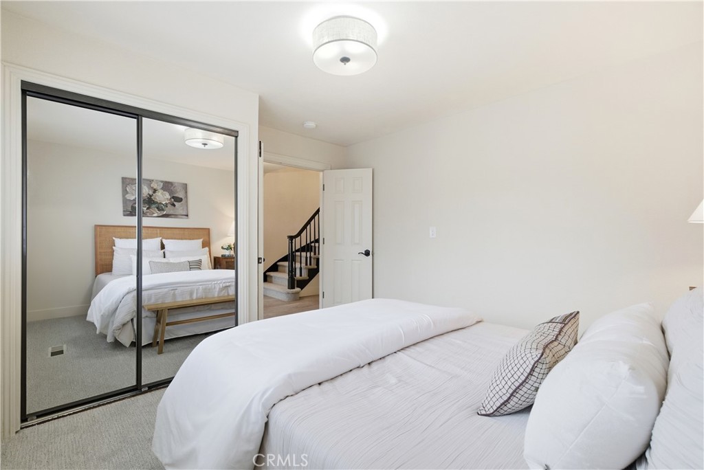 21630 Edward Way Cupertino, CA 95014 - Photo 28 of 59 a bedroom with a bed and a mirror