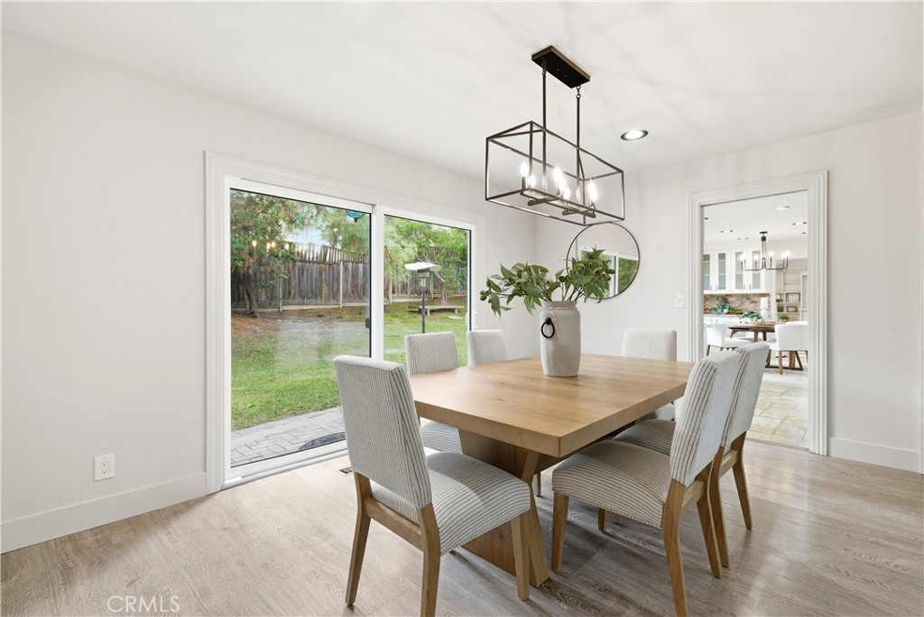 21630 Edward Way Cupertino, CA 95014 - Photo 9 of 59 a view of a dining room with furniture wooden floor and chandelier