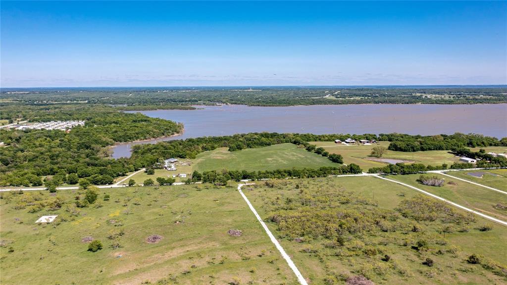 185 Triangle Road Valley View, TX 76272 - Photo 6 of 10 a view of a city with an ocean beach