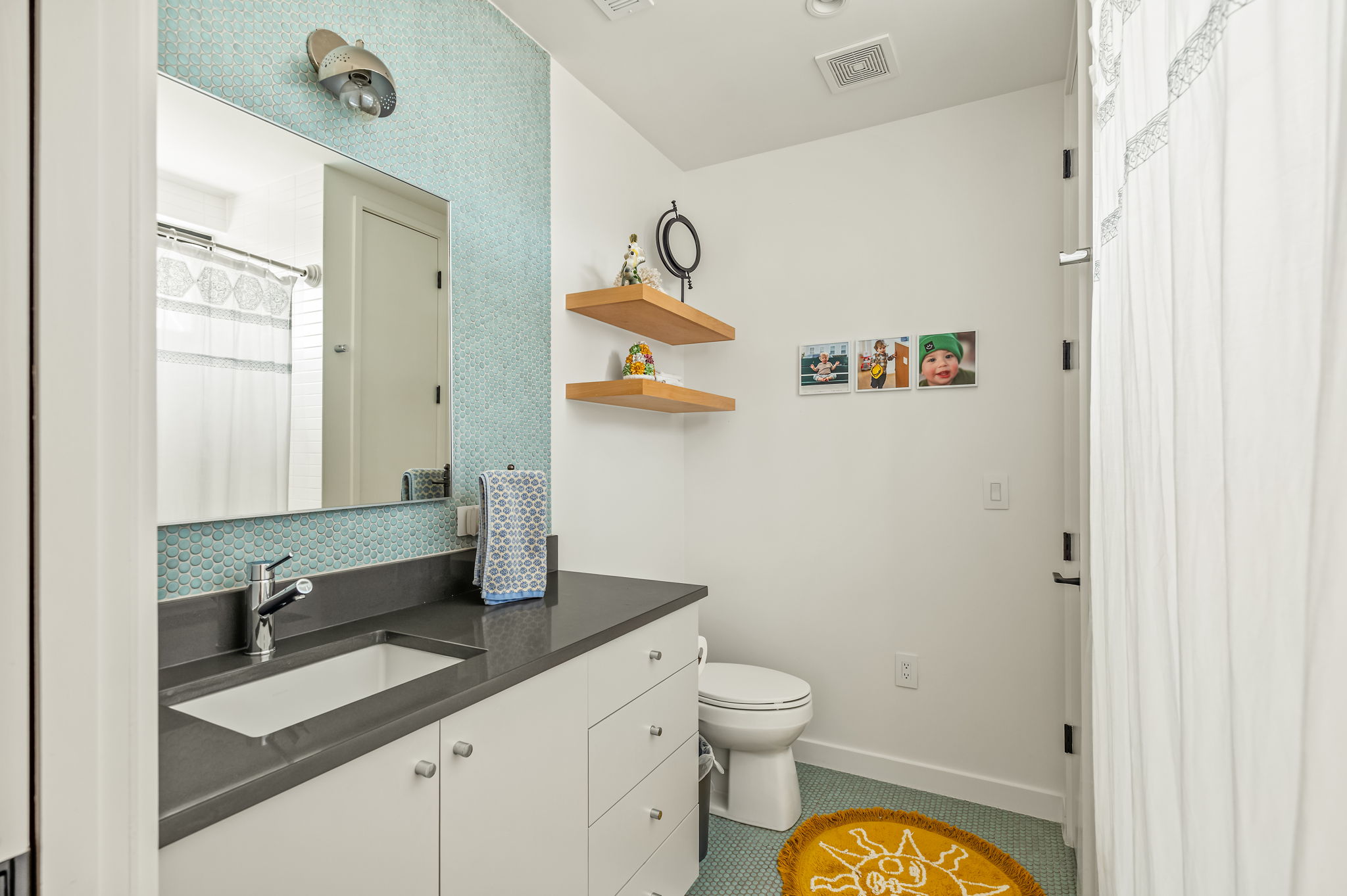1811 Collier Street Austin, TX 78704 - Photo 30 of 40 Full bathroom with vanity, curtained shower, and tile patterned floors