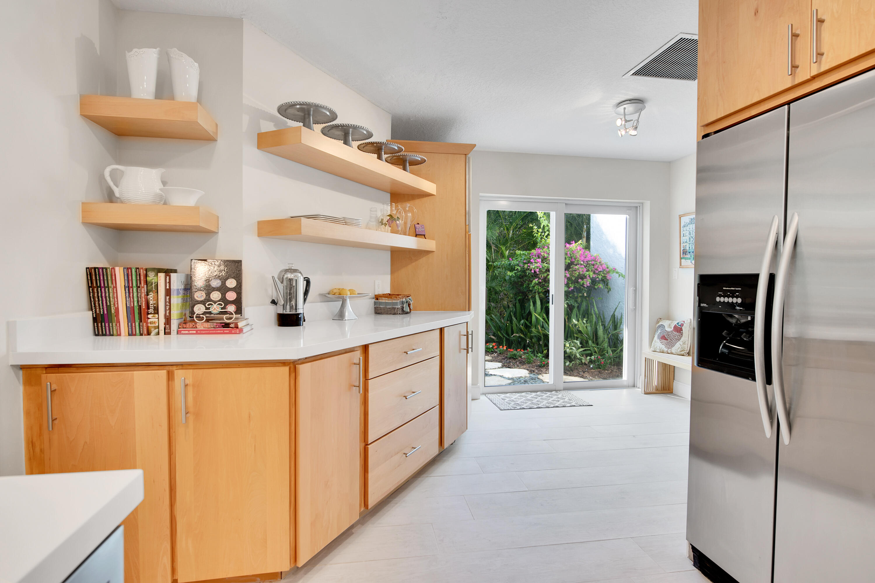 2932 Banyan Blvd Circle Northwest Boca Raton, FL 33431 - Photo 13 of 57 a kitchen with stainless steel appliances a refrigerator and a sink