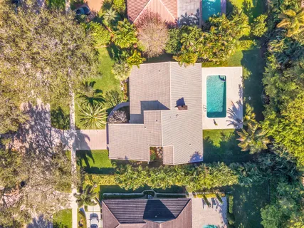 a view of a patio with a table chairs and a backyard