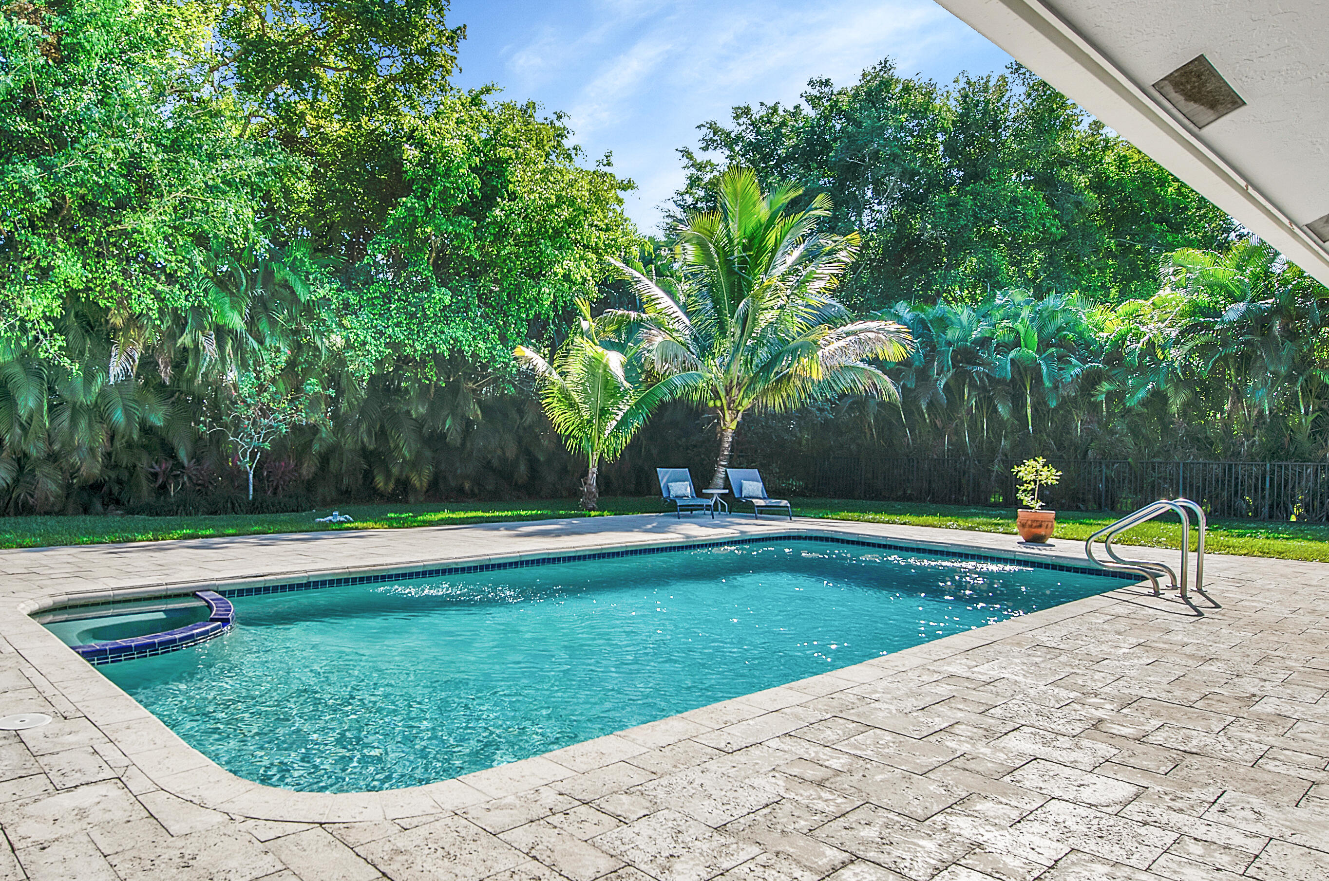 2932 Banyan Blvd Circle Northwest Boca Raton, FL 33431 - Photo 36 of 57 a view of a swimming pool with a patio
