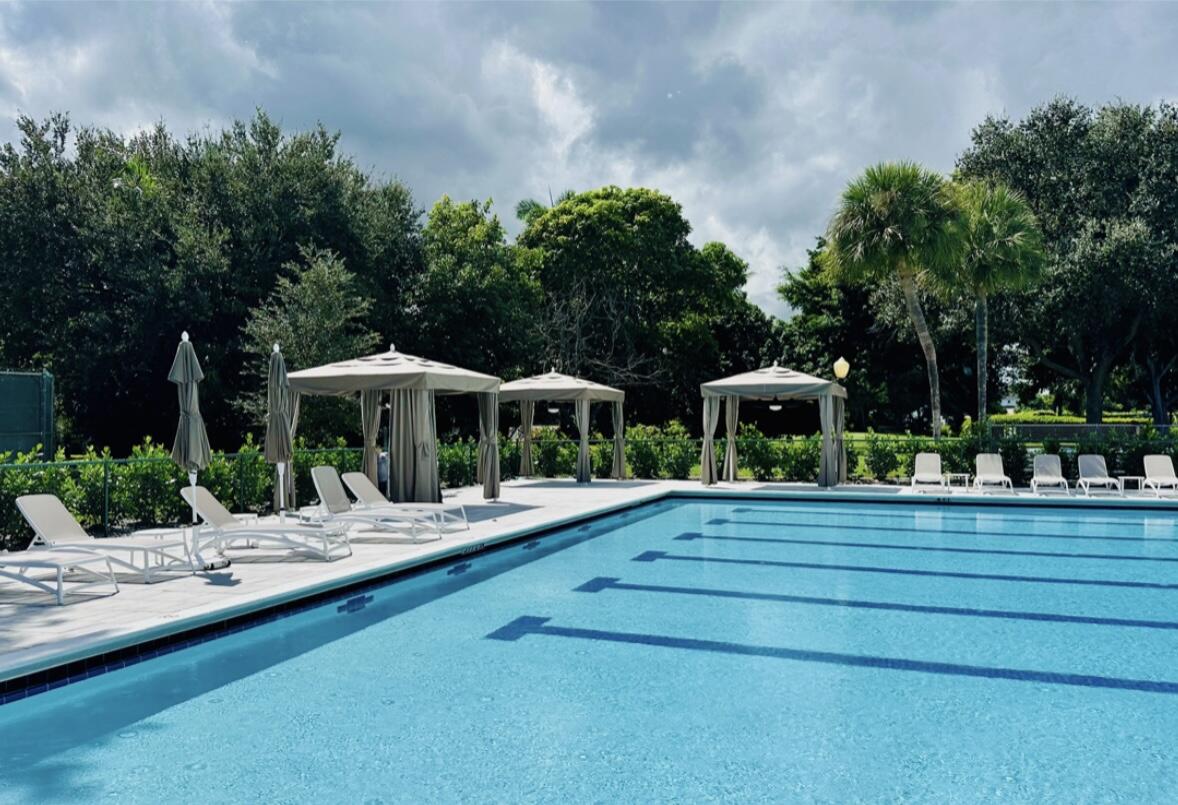 2932 Banyan Blvd Circle Northwest Boca Raton, FL 33431 - Photo 45 of 57 a front view of a house with garden