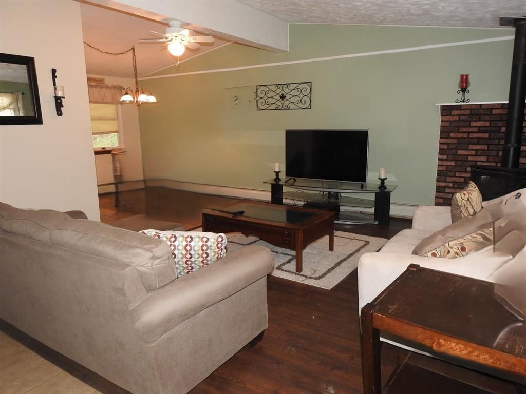 725 State Street Oneonta, NY 13820 - Photo 12 of 25 Living room with dining area adjacent to kitchen,