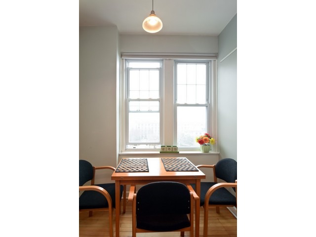 6342 North Sheridan Road, Unit 5B Chicago, IL 60660 - Photo 12 of 25 a view of a dining room with a table and chairs