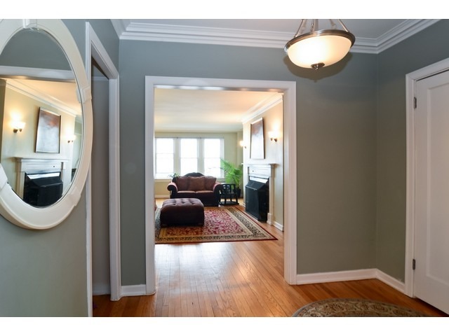 6342 North Sheridan Road, Unit 5B Chicago, IL 60660 - Photo 2 of 25 a view of living room and bathroom with wooden floor
