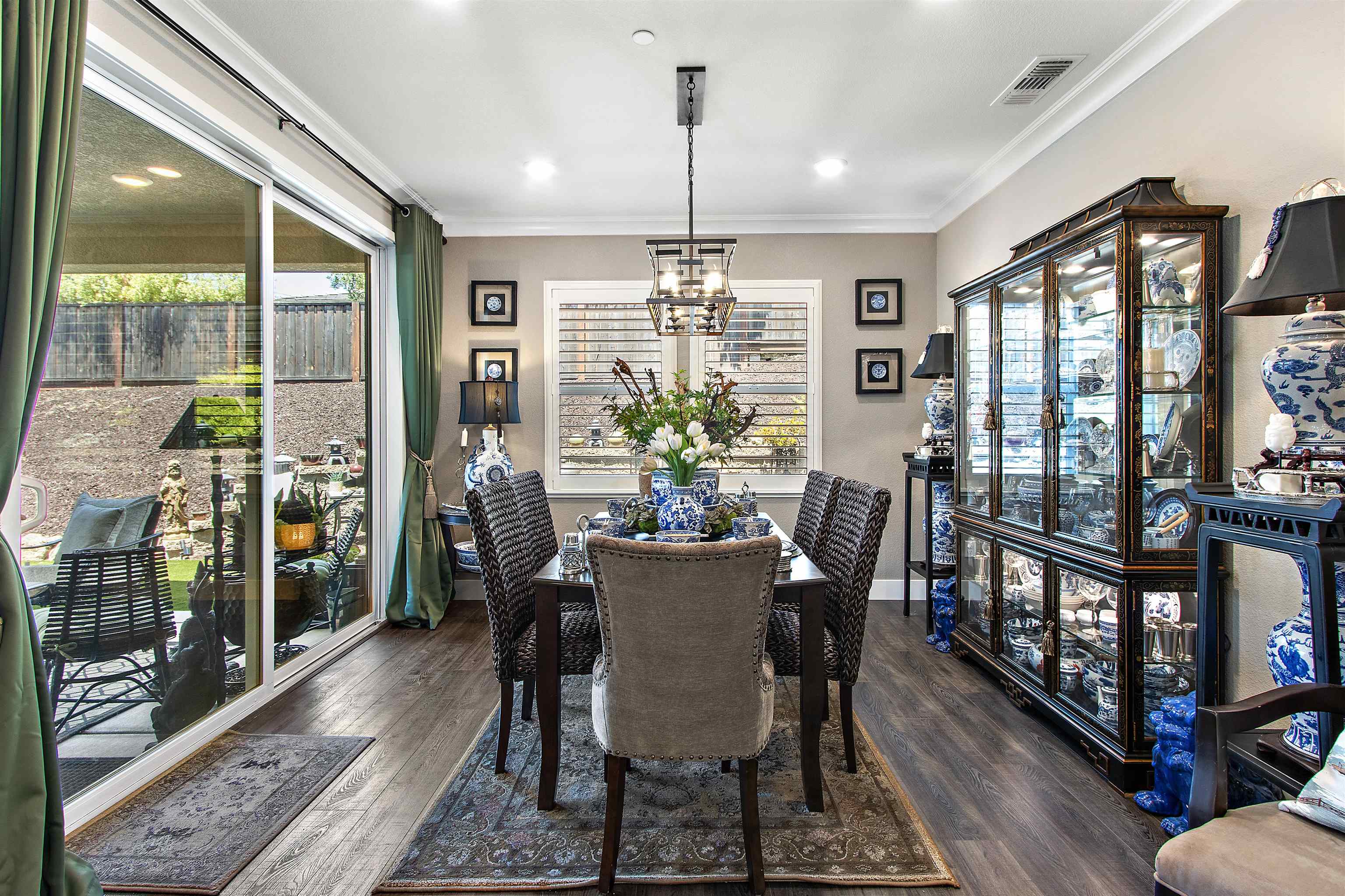 1311 Amalfi Court San Ramon, CA 94583 - Photo 14 of 59 a view of a dining room with furniture large windows and wooden floor