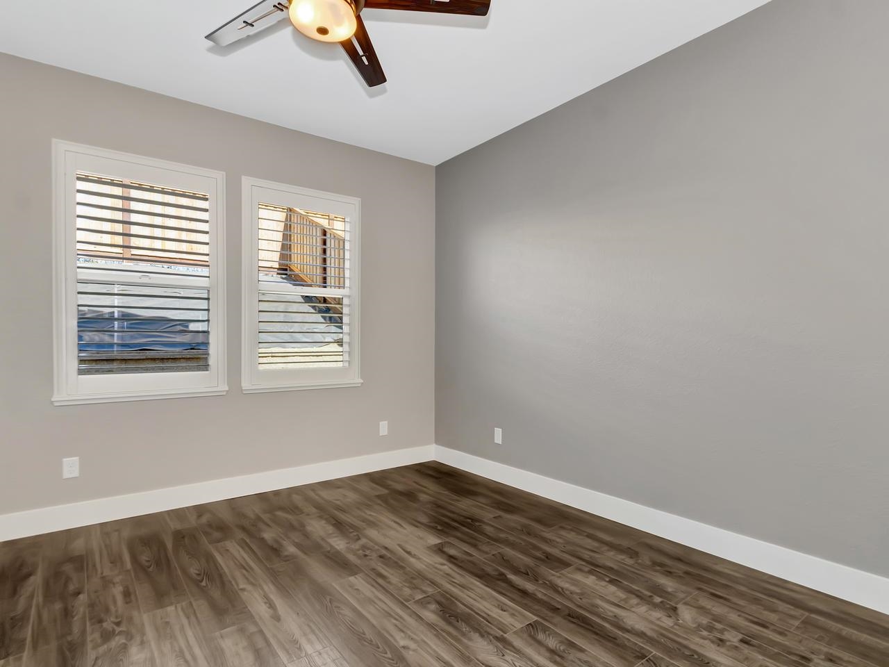 1311 Amalfi Court San Ramon, CA 94583 - Photo 16 of 59 a view of an empty room with wooden floor and a window