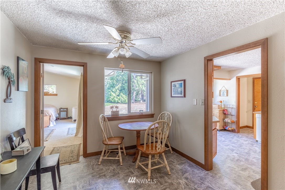 12410 Wagner Road Monroe, WA 98272 - Photo 8 of 30 a view of a dining room with furniture and a chandelier
