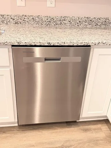 a view of a floor to ceiling window and a wooden floor