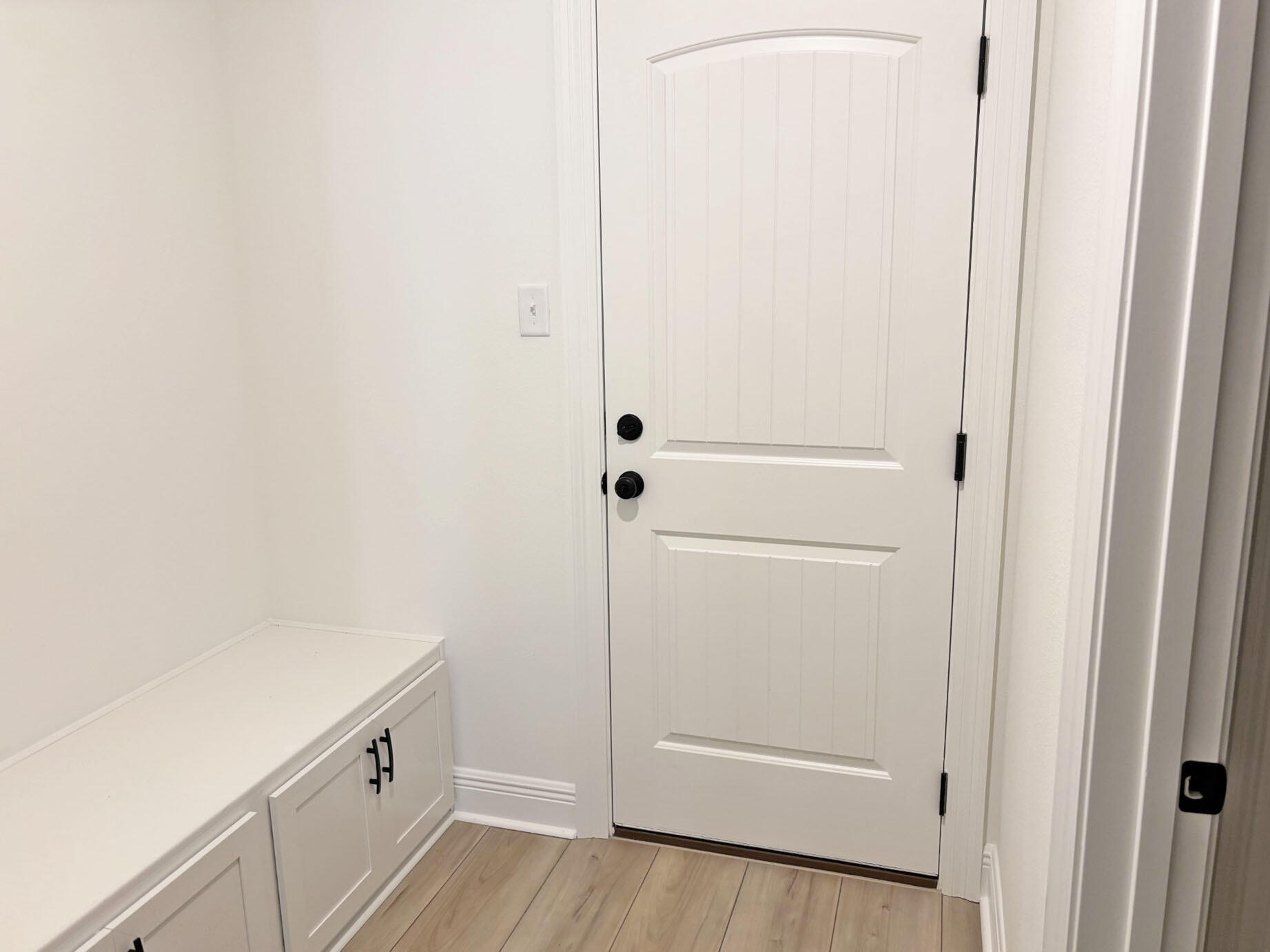 2745 Louis Circle Crestview, FL 32536 - Photo 15 of 18 a view of a hallway with white cabinets