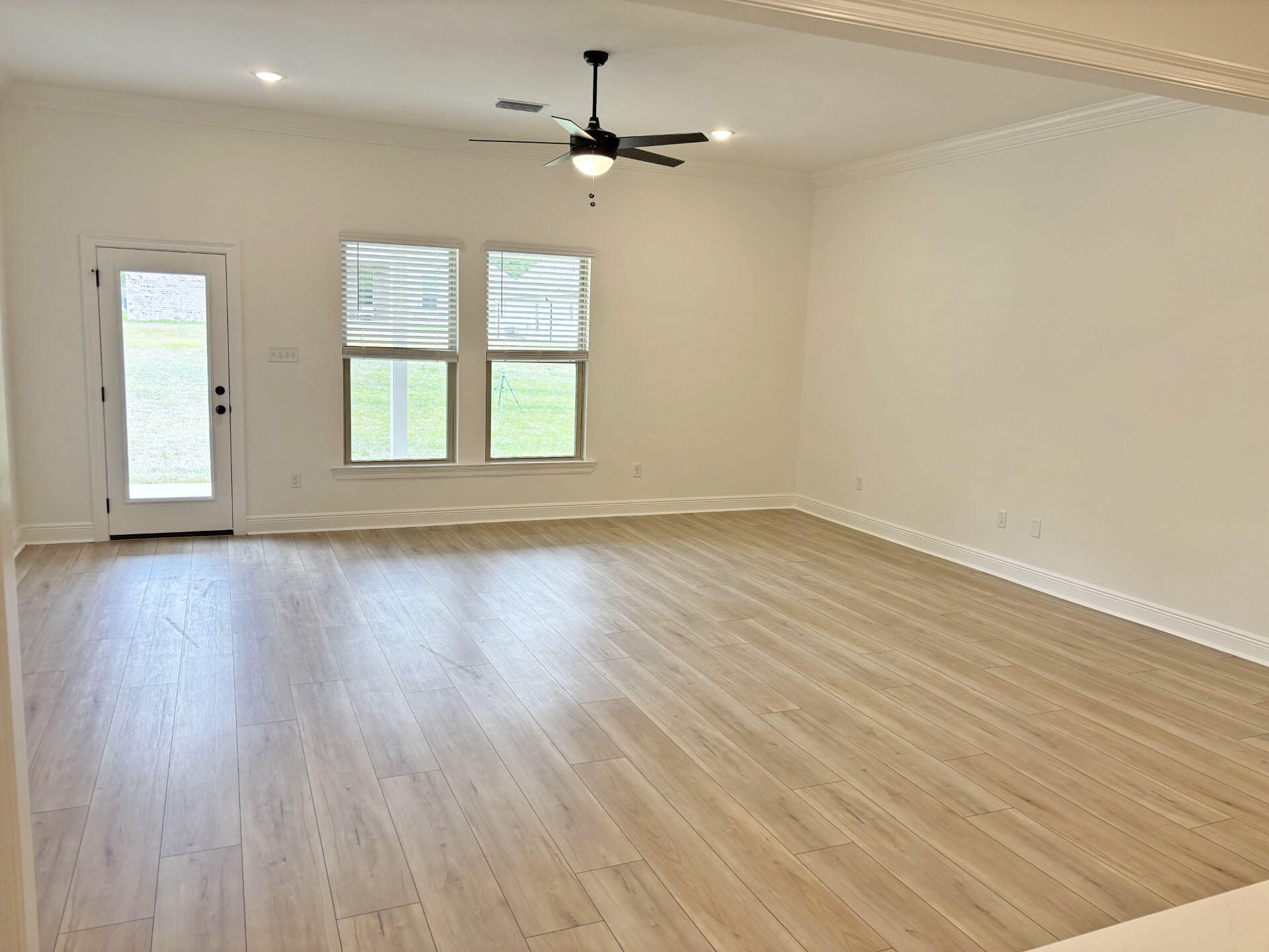 2745 Louis Circle Crestview, FL 32536 - Photo 5 of 18 wooden floor in an empty room with a window