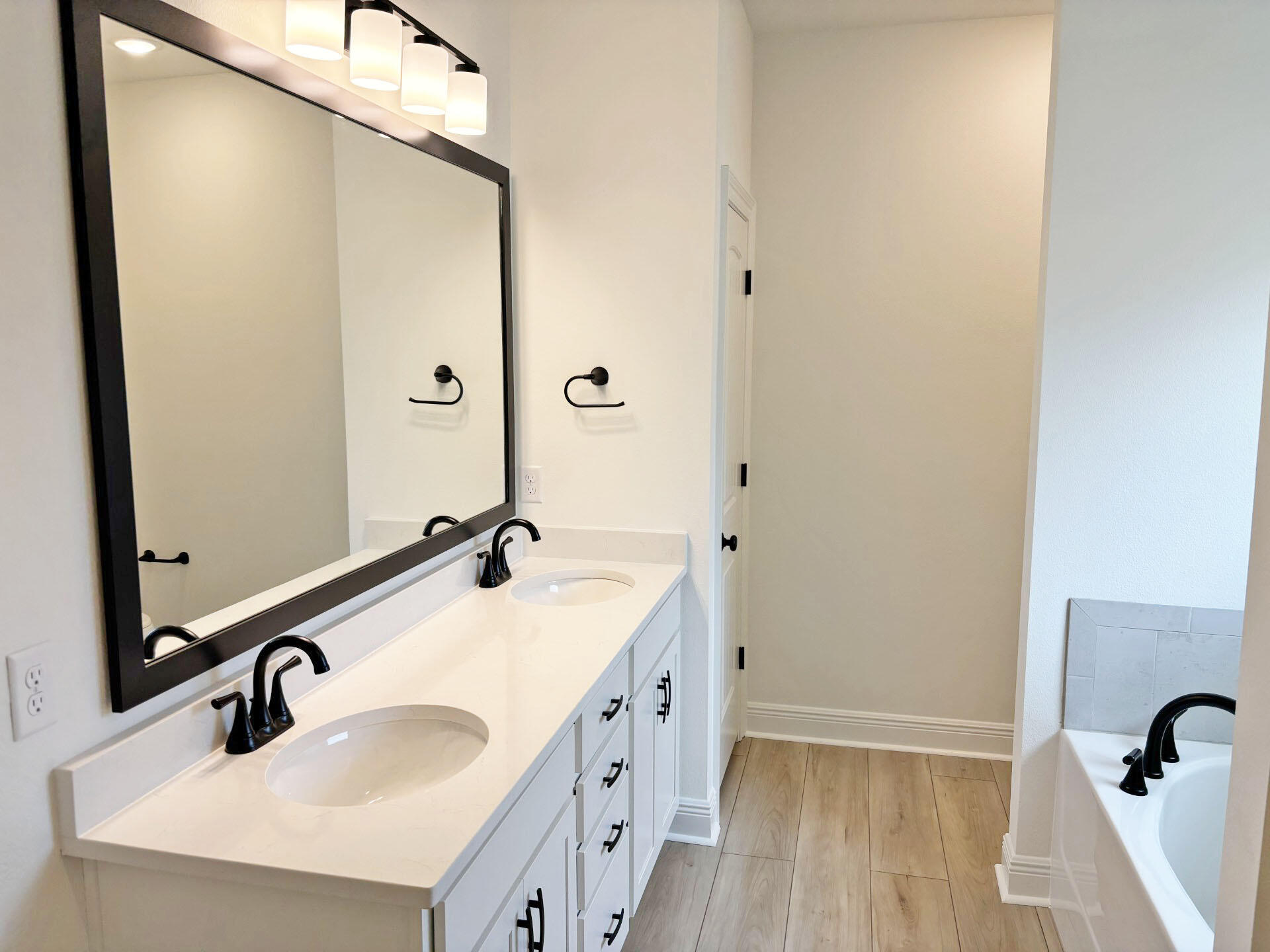 2745 Louis Circle Crestview, FL 32536 - Photo 8 of 18 a bathroom with a double vanity sink and mirror