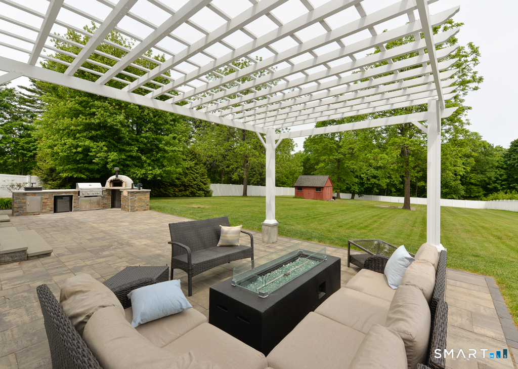 109 Harrison Lane Bethlehem, CT 06751 - Photo 2 of 28 a view of a patio with couches chairs and a yard