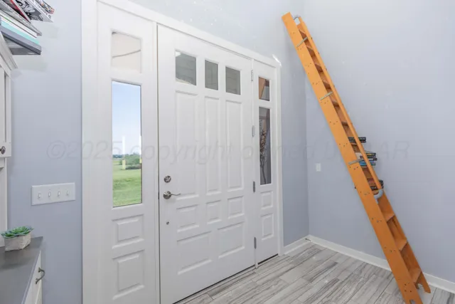 a view of kitchen dining table chairs and wooden floor