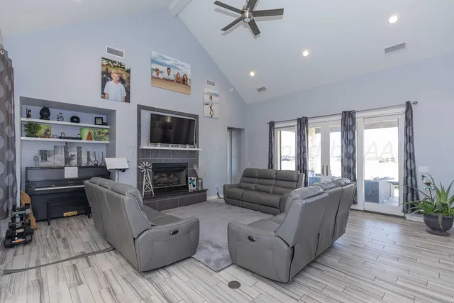 a living room with bed and a window