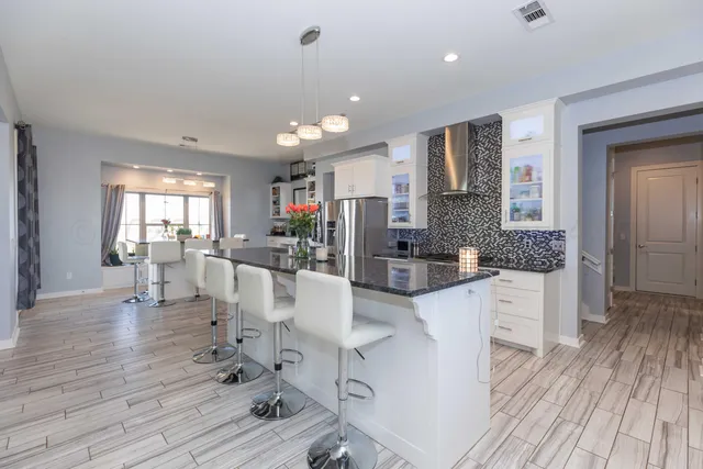 a spacious bedroom with a bed and furniture