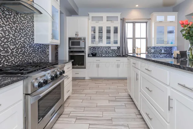 a living room with furniture and white walls