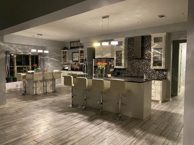 a view of a house with backyard and porch