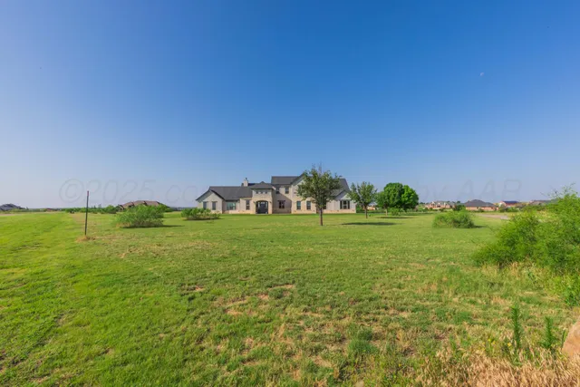 a view of a livingroom with furniture and stairs
