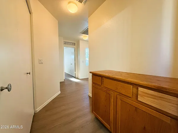 a view of hallway with wooden floor