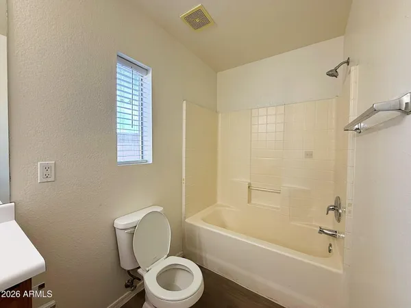a bathroom with a toilet bathtub and a shower