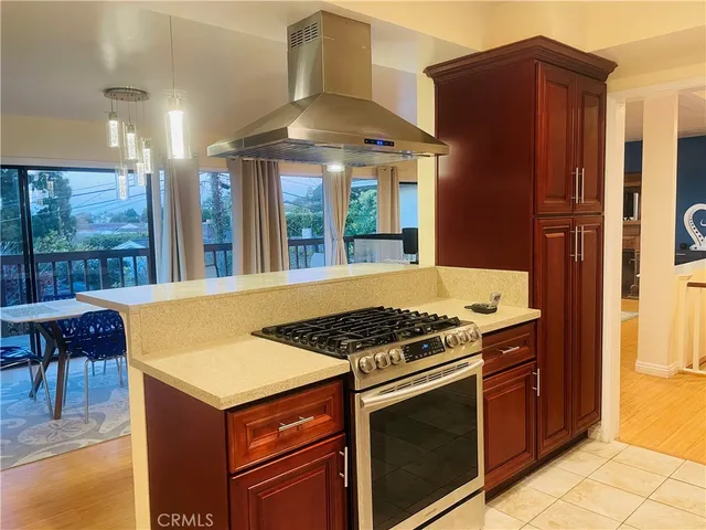 a kitchen with a stove and a refrigerator